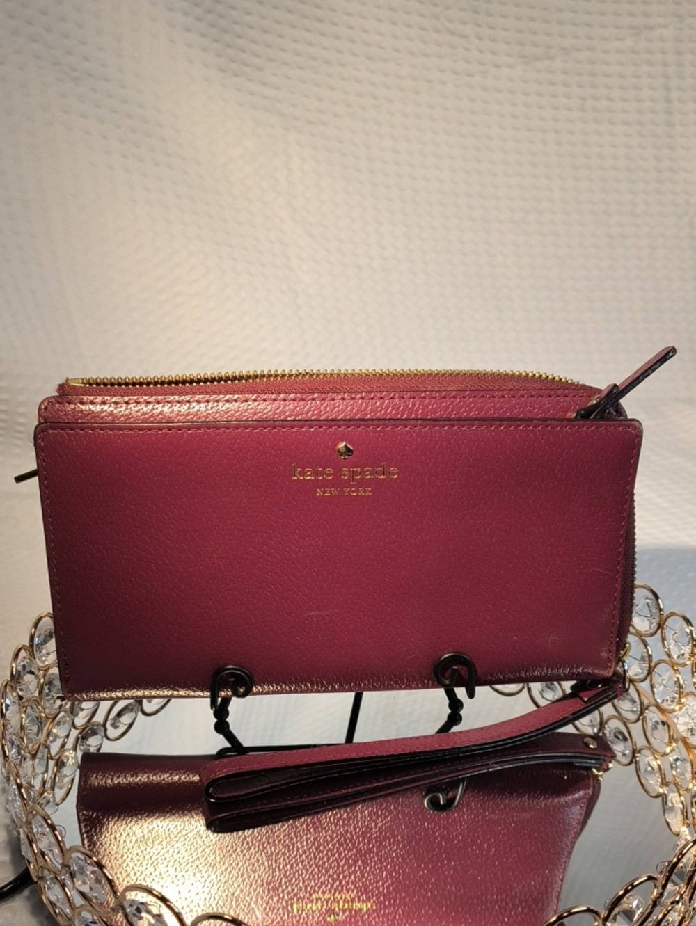 kate spade plum leather wristlet with gold hardware And Side Zippered Compartmen